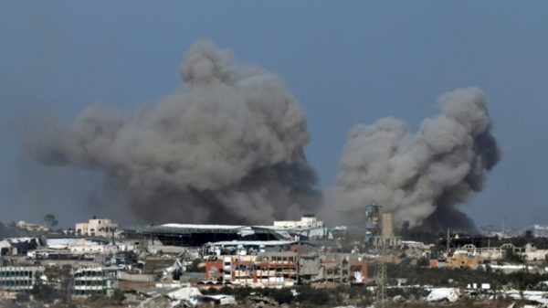 Smoke billows over the Palestinian territory of Gaza during Israeli bombardment on December 29, 2023
