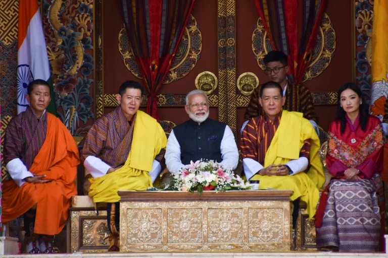 Indian Prime Minister Narendra Modi (C), Bhutan's King Jigme Khesar Namgyel Wangchuck (2L), the Fourth Druk Gyalpo (2R), Queen Jetsun Pema (R) and then prime minister Lotay Tshering (L) watch a cultural performance at the Tashichho Dzong during Modi's visit to Bhutan in 2019