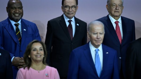 Mexican President Andres Manuel Lopez Obrador, in the back row on the right, and US President Joe Biden, in the front row on the right