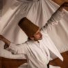 The tall felt hat of swirling dervishes represents a tombstone