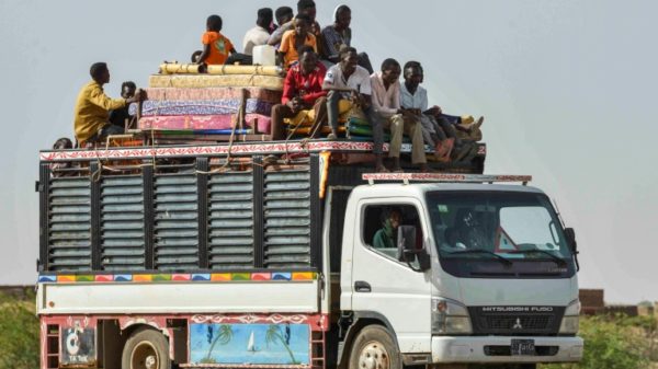 People move on June 22, 2023 along a road from Khartoum to Wad Madani, which became a safe haven until Sudan's war spread into the city and forced a new exodus