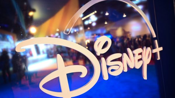 Fans are reflected in Disney+ logo during the Walt Disney D23 Expo in Anaheim, California in September 2022