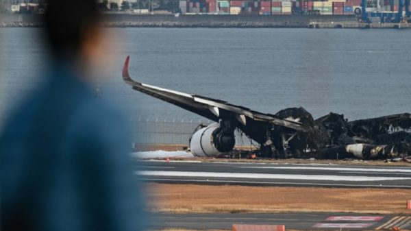 Charred remains of the planes were still littering one of Haneda's four runways