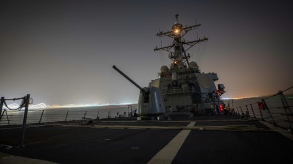 The US guided-missile destroyer USS Carney shot down more than a dozen drones in the Red Sea launched from Huthi-controlled areas of Yemen, defense officials say