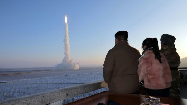 North Korean leader Kim Jong Un (L), seen watching a test launch of his country's largest ICBM, has urged his party to 'accelerate' war preparations