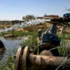 Water flows from irrigation pipes in the Palestinian village of al-Auja in the occupied West Bank