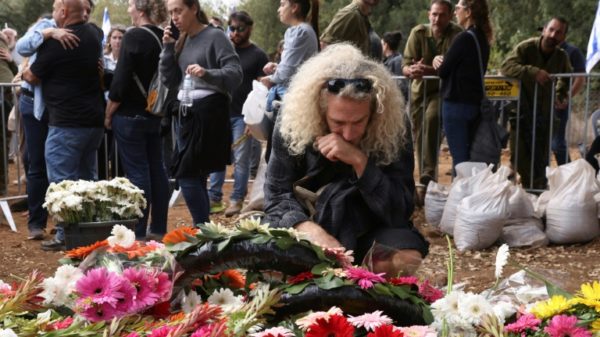 Israeli soldiers and civilians attend the funeral of Matan Meir, a producer of the Netflix series 'Fauda' who was killed in combat while on reserve duty for the army during its war with Hamas