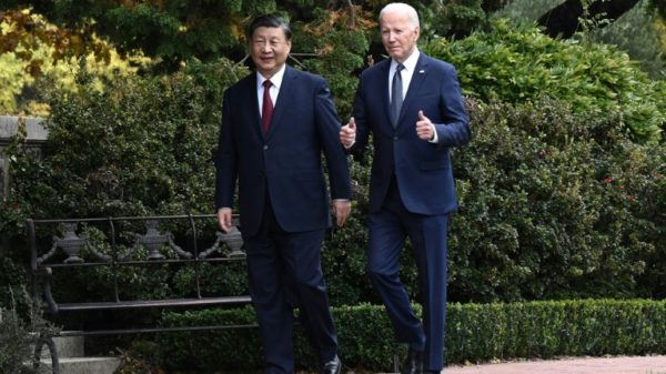 US President Joe Biden and Chinese President Xi Jinping walk together after a meeting in Woodside, California on November 15, 2023
