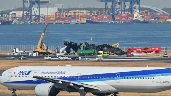 All 367 passengers and 12 crew on board the Japan Airlines plane escaped down emergency slides