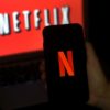 Netflix says its new ad-subsidized subscription tier is starting out better than expected, and that it will begin a broad rollout of paid plans for people who share passwords with other households