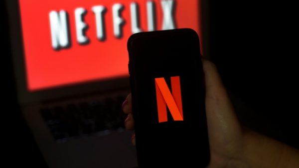 Netflix says its new ad-subsidized subscription tier is starting out better than expected, and that it will begin a broad rollout of paid plans for people who share passwords with other households
